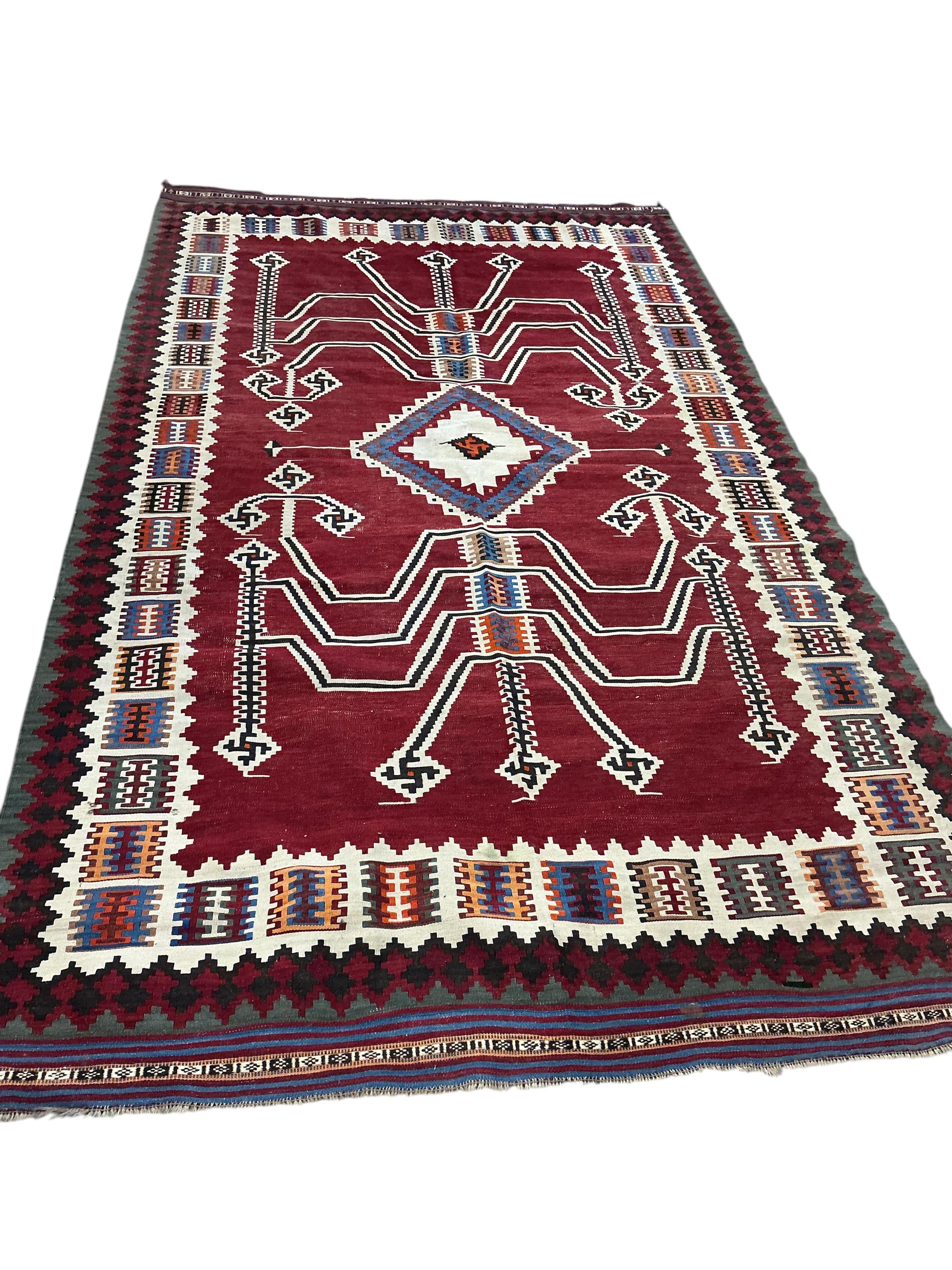 A Persian polychrome Kilim carpet, 284 x 160cm